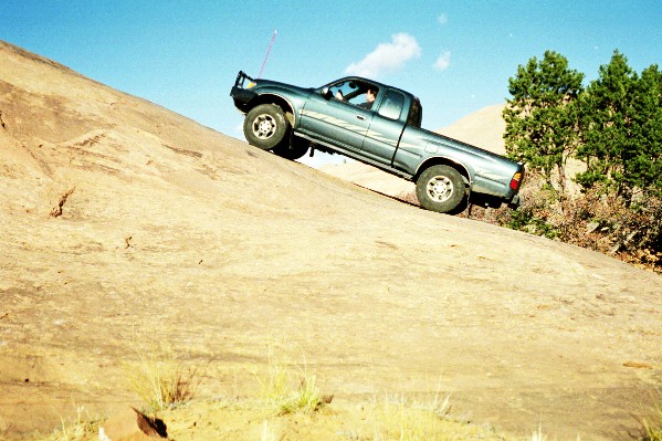 Matt guns his taco up Mini Lion's Back. It felt great to finally air down and get off road onto the slickrock of Moab